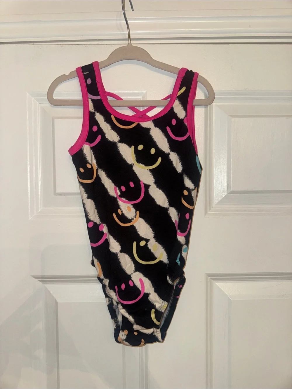 Pixielane Black Smiley Print One-Piece bodysuit with Pink Trim